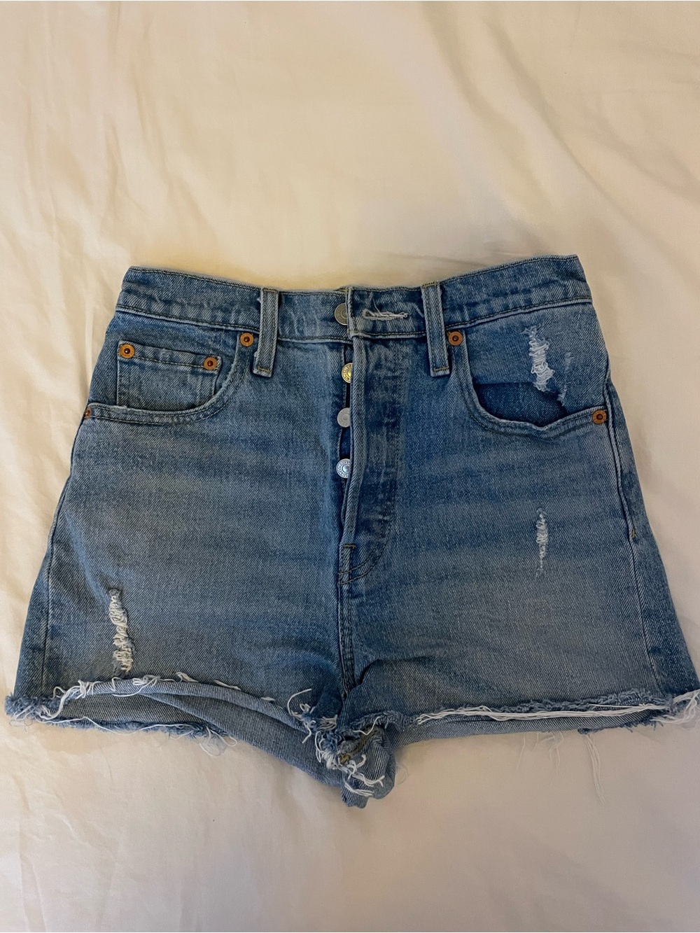 Levi's Button-Fly Distressed Denim Shorts in Blue